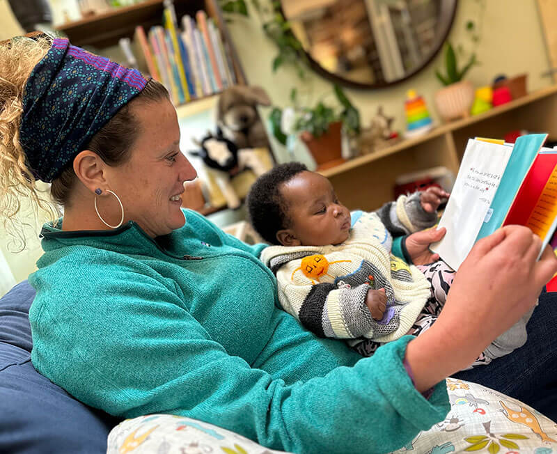 A women reading to a very young child