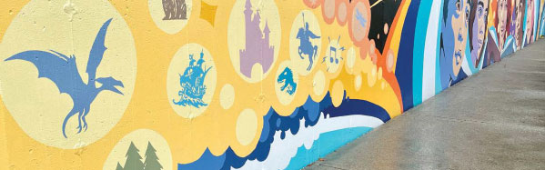 Colorful wall mural with images from children's books